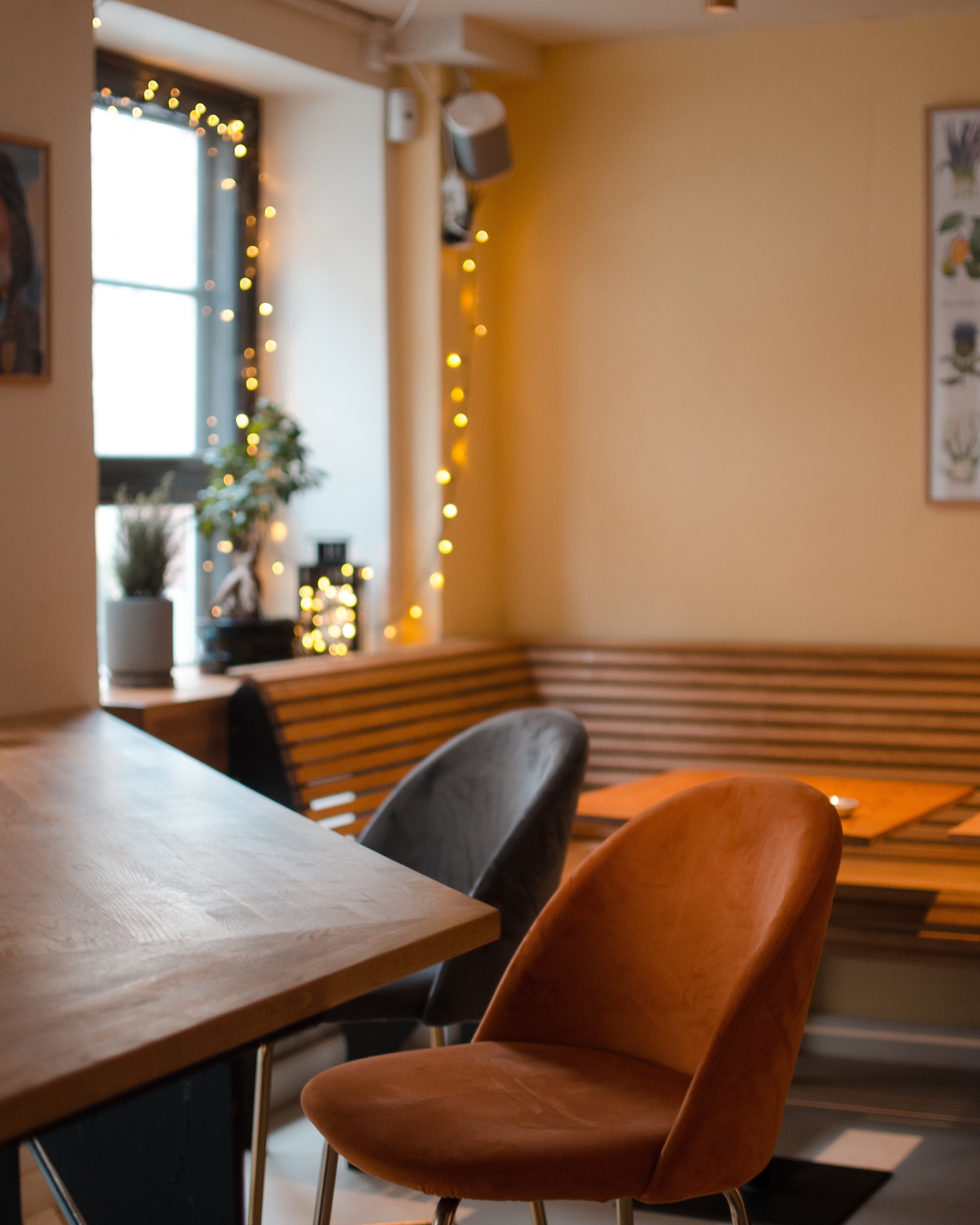 Cozy interior of Venner café with warm lighting and modern Scandinavian furniture